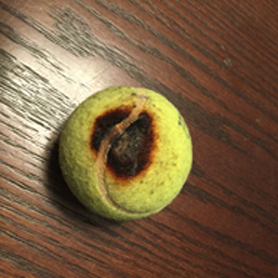A burnt tennis ball from a home in Calgary